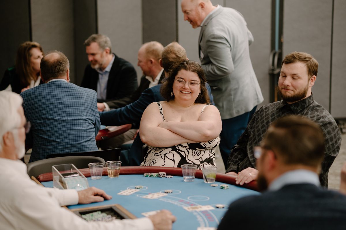 Team member smiling while playing blackjack