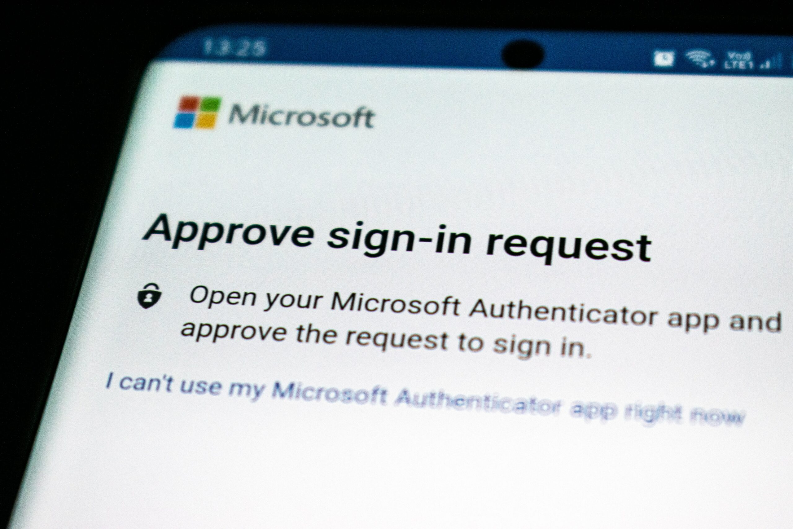 A smartphone displays Microsoft's sign-in request utilizing 2 factor authentication.