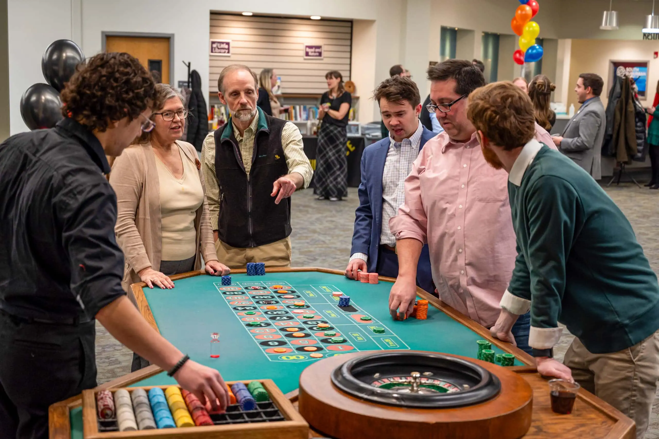 A group of people playing roulette at a K3 event.