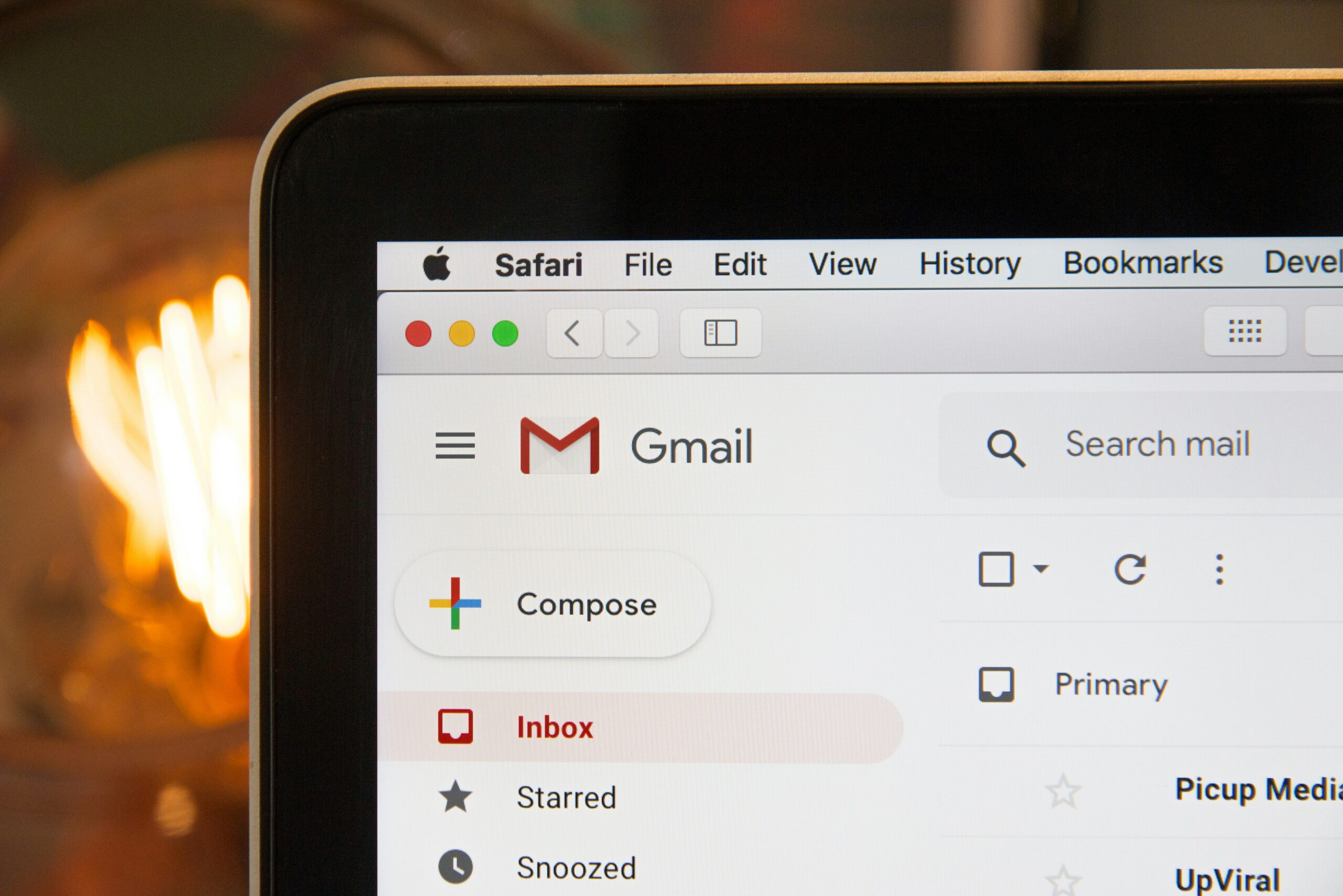 A laptop is displaying the Gmail of an individual who uses the SLAM method.
